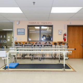A hospital dialysis room equipped with medical equipment for patient treatment.