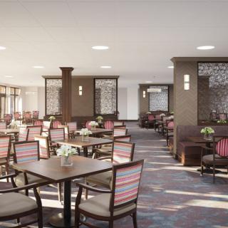 A modern restaurant dining area with neatly arranged tables and chairs.