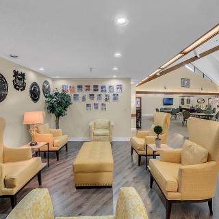 A cozy lounge area with comfortable yellow chairs and stylish decor.