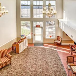 Spacious lobby area with elegant lighting and comfortable seating.