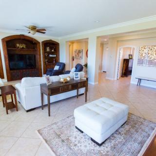 A spacious living room featuring cozy furniture and modern decor.
