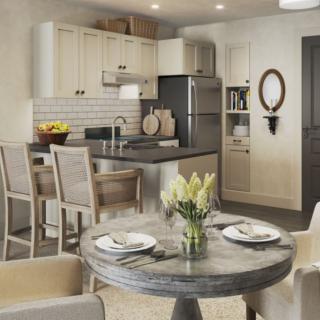 A modern kitchen with a dining area featuring stylish decor and stainless steel appliances.