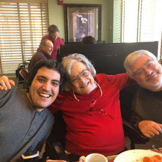 A joyful moment shared among friends during a meal.
