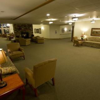 A spacious lobby area with comfortable seating and warm lighting.
