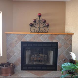A cozy fireplace adorned with decorative elements, perfect for a warm home ambiance.