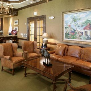 A well-appointed living room with leather furniture and elegant decor.