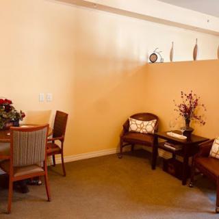 A cozy living space featuring a dining area and elegant seating arrangements.
