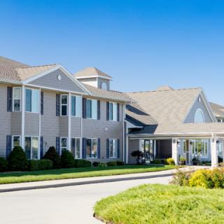 A modern residential building with well-maintained landscaping.