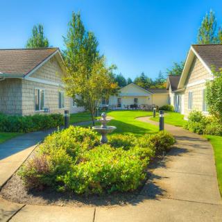 A picturesque view of a residential area with well-maintained pathways and lush greenery.