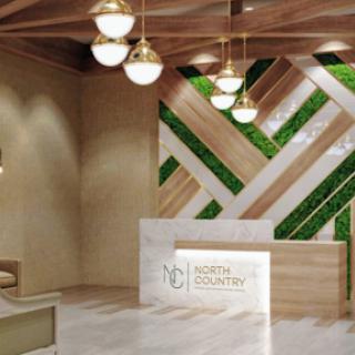 A contemporary reception area with wooden accents and greenery.