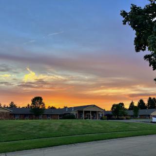 A beautiful sunset paints the sky in vibrant colors over a peaceful landscape.