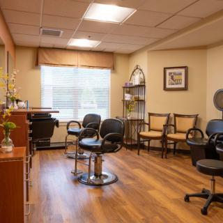 A cozy hair salon with a welcoming waiting area and styling stations.