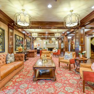 A luxurious lounge area with plush seating and ornate decor.