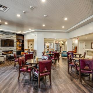 A modern dining area with elegant seating and ambient lighting.