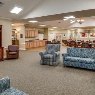 A spacious lounge area with comfortable seating and an open layout.