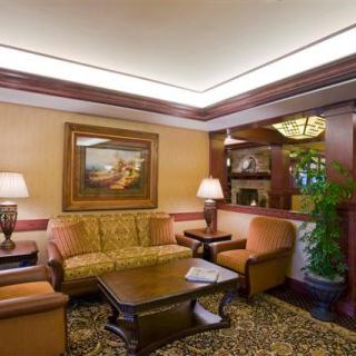 A cozy hotel lobby with a comfortable seating area and warm lighting.