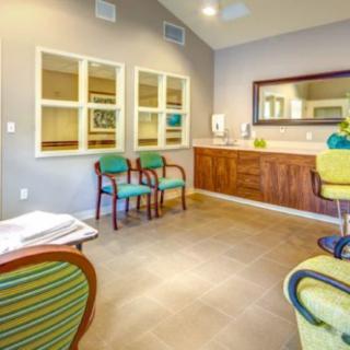 A modern waiting room with comfortable seating and a welcoming reception area.