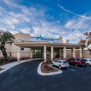 A modern healthcare facility featuring a welcoming entrance and well-maintained surroundings.