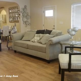 A cozy living room with a comfortable sofa, stylish furniture, and elegant decor.