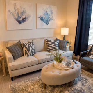 A cozy and modern living room setup featuring stylish decor and comfortable seating.
