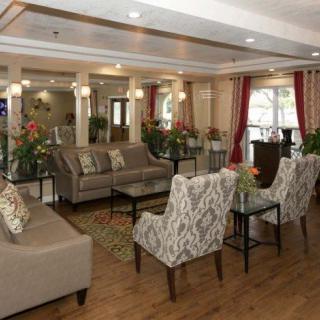 A spacious and elegantly designed living room with comfortable seating and stylish decor.