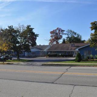 A peaceful residential building on a sunny day.