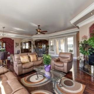 Spacious living room with comfortable seating and elegant decor.