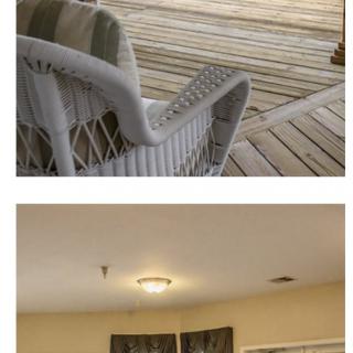 Wicker chair on a wooden deck and a ceiling light in an indoor setting.