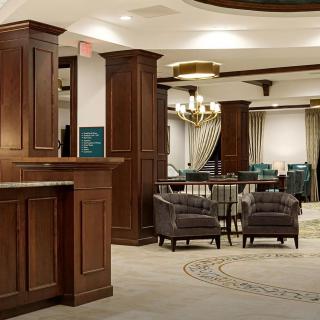 Elegant hotel lobby with comfortable seating and warm wood accents.