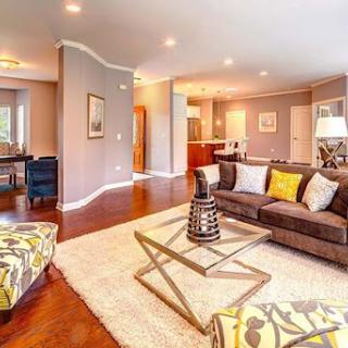 A stylish and inviting living room featuring modern furniture and warm tones.