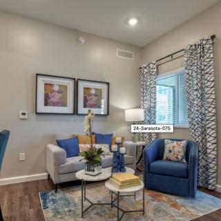 A cozy, modern living room with blue accents and contemporary furniture.
