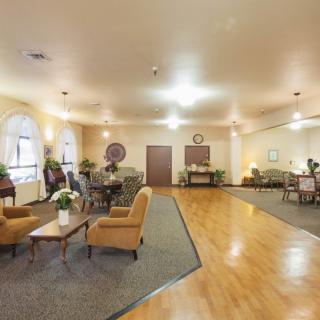 A spacious living room with comfortable seating and elegant decor.