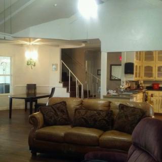 Spacious living room with a view of the dining area and kitchen.