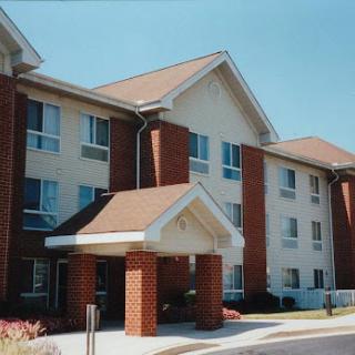 A modern multi-story hotel building showcasing a welcoming entrance.