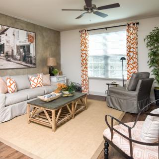 A cozy and stylish living room with a sofa, coffee table, and decorative elements.