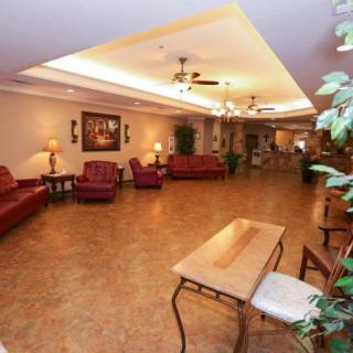A spacious lobby with comfortable seating and warm lighting.
