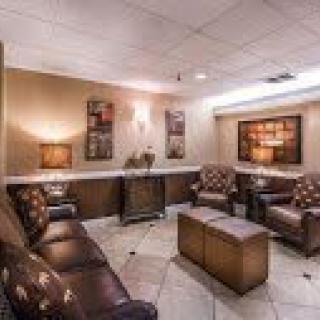 A cozy waiting room with comfortable seating and warm lighting.