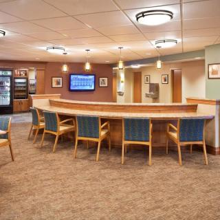 A comfortable lobby area with seating and a reception desk.