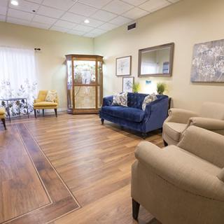 A cozy waiting area featuring comfortable seating and elegant decor.