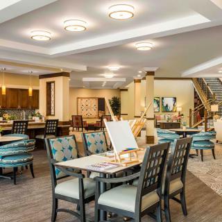 A modern dining area with elegant furniture and bright lighting.