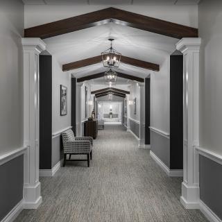A modern hallway with elegant architectural design and lighting.