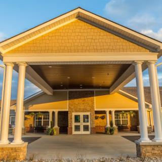 The inviting entrance of a well-designed residential building during sunset.