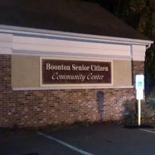 A sign for the Boonton Senior Citizens Community Center, illuminated at night.
