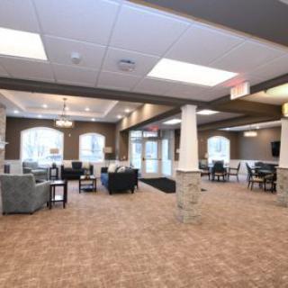 A spacious and well-lit lobby with comfortable seating arrangements.