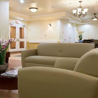 A modern lobby featuring comfortable sofas and elegant lighting.