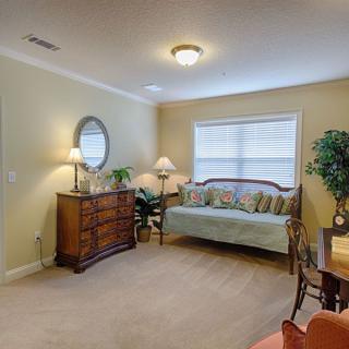 A cozy living room with a sofa, table, and decorative elements.