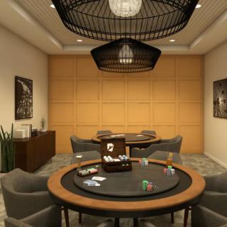 A stylish game room featuring a poker table, comfortable seating, and elegant lighting.