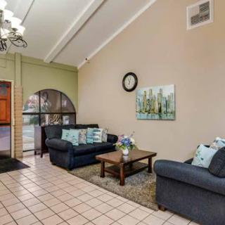 A cozy living room featuring comfortable sofas, a stylish coffee table, and decorative artwork.
