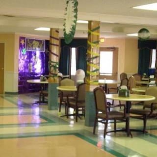 A decorated dining area with tables and chairs arranged neatly.