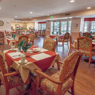 An elegant dining room with tables set for guests.
